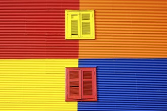 Colourful wall with two windows in La Boca, Buenos Aires