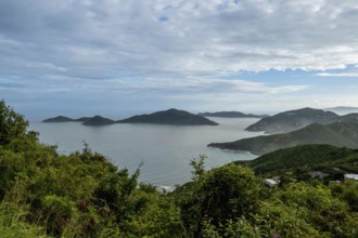 Tortola, in the British Virgin Islands, captivates with lush hills, white sand beaches, and vibrant