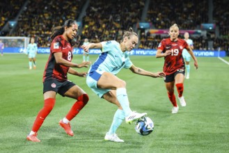 MELBOURNE, AUSTRALIA, JULY 31: Caitlin FOORD of Australia and Jayde RIVIERE of Canada tackle as