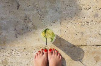 Lemonade glass on stone background