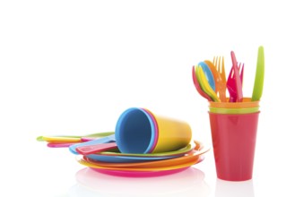 Picnic crockery and cutlery in all colors isolated over white background