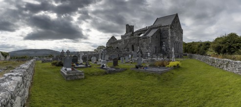 Ballyvaughan, Ireland, 28 July, 2022: panorama view of the historic 13th-century Corcomroe Abbey
