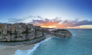 Tropea, Italy, 16 December, 2023: panorama view of Rotonda Beach and the colourful old town of