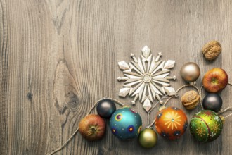 Christmas decoration glass balls on a wooden background