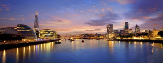 London skyline sunset with City Hall and financial on Thames river