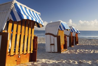 Sandy beach and traditional wooden beach chairs on Rugen island, Northern Germany, on the coast of