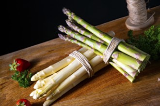 Green and white asparagus on the table