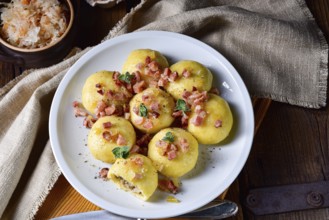 Polish dumplings with meat and mushroom sauerkraut filling