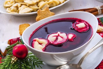Barszcz (beetroot soup) with small pierogi