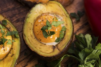 Homemade Organic Egg Baked in Avocado with Salt and Pepper