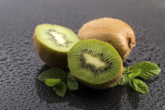 Juicy kiwi fruit and freas mint leaves