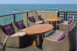 Empty table in a restaurant overlooking the sea