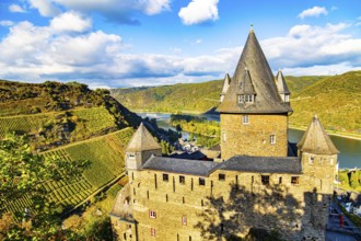 Round towers with conical peaked roofs. Sunset. Rhine Castles: Journey into the German Middle Ages.