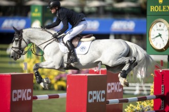 Irish rider Darragh Kenny riding VDL Cartello competes in the second round and jumpoff of the CPKC