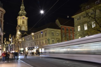 Graz, Austria - November 30, 2019: beautiful Christmas decorations on Herrengasse street, at night,