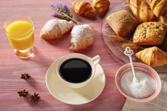 Coffe breakfast with orange juice croissant bread and yogurt