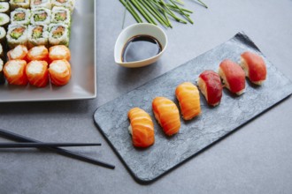 Sushi Maki and Niguiri with soy sauce and California roll