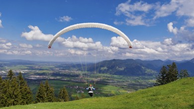 Paraglider takes off from the Blomberg launch site