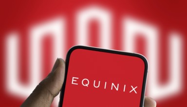 Equinix logo is displayed on smartphone. Equi nix Inc is an American multinational company.