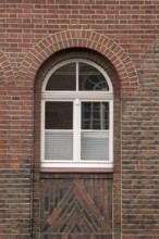 Large mullioned window on a 100-year-old building