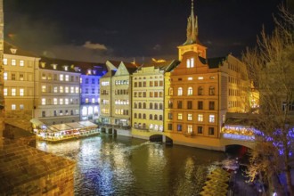 View from the Charles Bridge on the medieval houses of Prague, painted in different colors and the