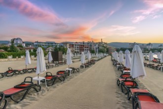 Chairs and umbrellas on a beautiful beach at sunrise in Sunny Beach on the Black Sea coast of