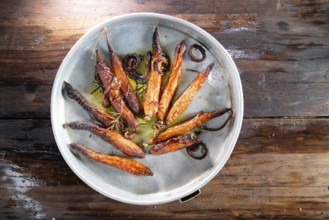 Photographic reproduction of a portion of carrots roasted in the oven