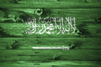 Saudi Arabia flag on wooden planks background wood flag