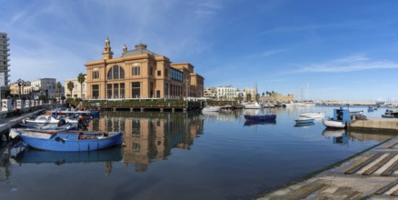 Bari, Italy, 27 November, 2023: view of the historic Teatro Margherita building and fishermen