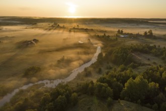 Sunset aerial atmospheric view on river in Ural Russia. Drone photography