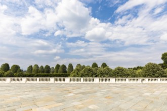 Exterior with old grey floor made of stone. Vintage textured pavement and blue sky in the
