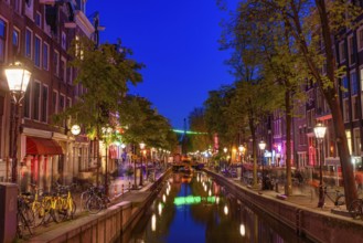 Night view of De Wallen, the famous red-light district with window prostitution in Amsterdam,