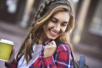 Awesome girl in urban style walk in city with coffee