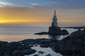 The Athopol Lighthouse on the Black Sea coast of Bulgaria with tidal pools in the foreground at