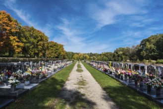Anderlecht, Brussels, Belgium, 10 11 2018: Decorated grave yards on a cemetery against blue sky,