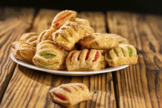 Cookies from puff pastry with coloured jam