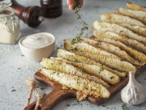 Baked Parmesan Garlic Zucchini. Thyme leaves fall on oven baked zucchini. Ideas and recipes for