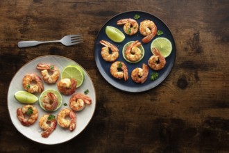 Shrimps, overhead flat lay shot on a rustic wooden background, with copy space. Cooked shrimp with