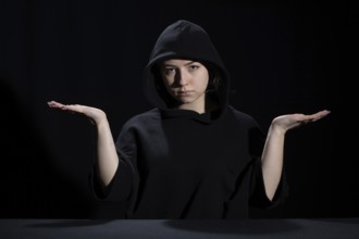 A young woman is waiting for the development of the situation in difficult conditions on the labor