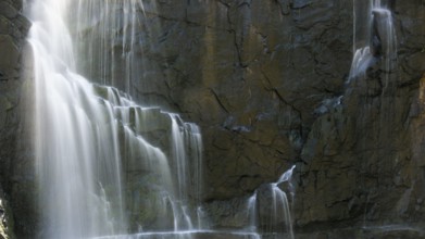 Detail of a waterfall in long exposure and rocky background, Australia, Oceania
