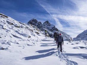 Trekking scene in winter on the italian alps