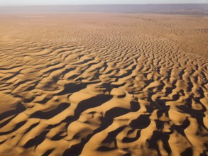 Aerial top high view landscape in Sahara desert at sunrise