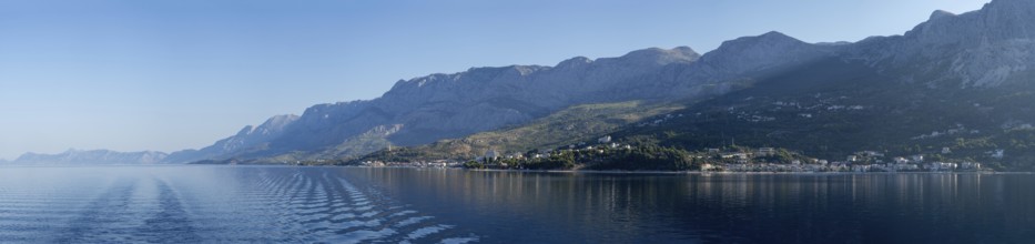 Mountain range by the sea in the morning light, panoramic shot, Makarska Riviera, near Makarska,