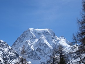 Beautiful view from Arolla, Switzerland, in winter: A high alpine peak with steep slopes covered