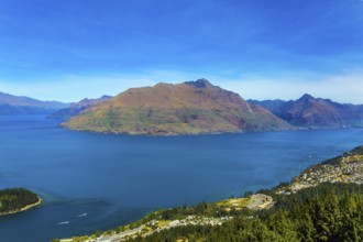 The concept of active, ecological and photo tourism. Bird's eye view. The city Queenstown, shores