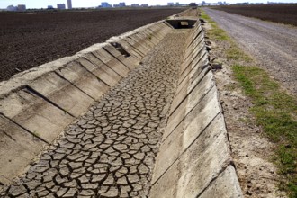 Dried irrigation ditch clay soil in Albufera rice fields of Valencia