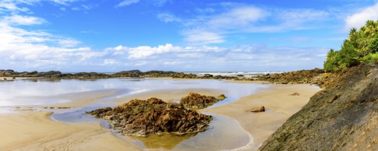 Panoramic image of beautiful Prainha beach located in Serra Grande in Bahia and surrounded by rocks
