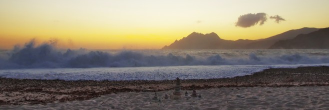 Surf wave at sunset on the beach in Porto, Corsica