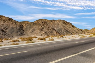 Asphalted road through mountains in egyptian desert