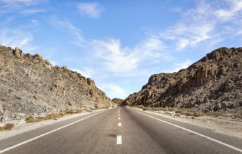 Speed highway through Egyptian mountains in desert